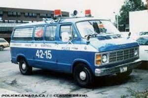 Blue Demers emergency ambulance van with roof lights, parked in an urban setting