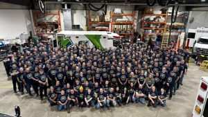 Large group of Demers employees standing together on the production floor